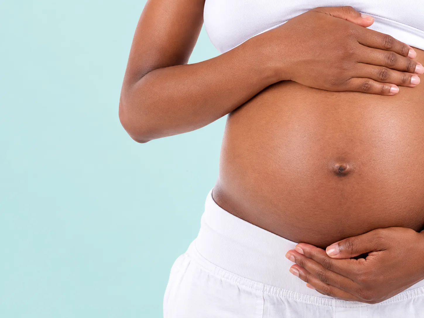 Expecting mother holding her belly